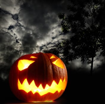 Angry halloween pumpkin on thunder sky background