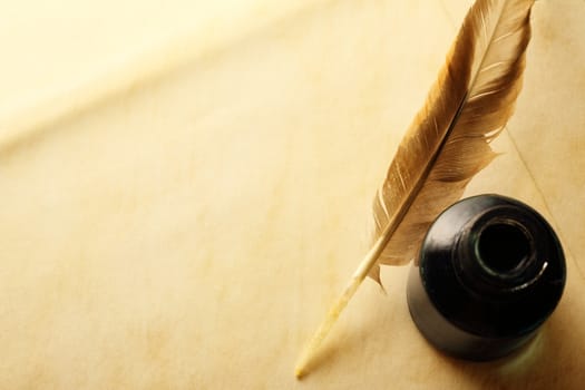 Blank envelope with inkwell and feather