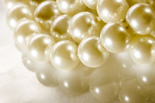 White pearl on reflective surface