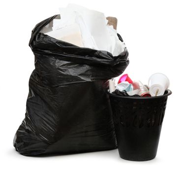 Full black wastebasket and plastic bag