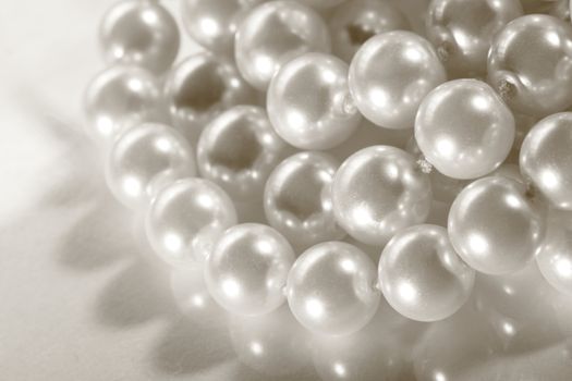 White pearl on reflective surface 