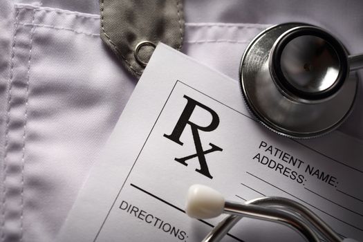 Stethoscope and patient list on doctor's smock