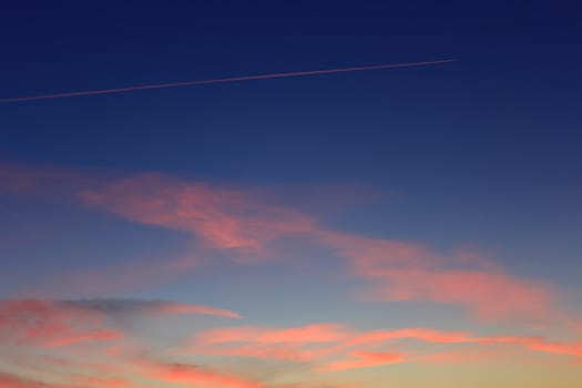 image of dark summer sunset with pinkclouds