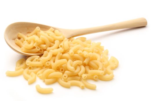Short ribbed pasta tubes and wooden spoon