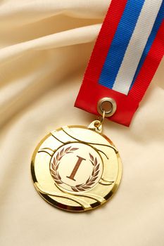 Metal medal on silk wrinkled cloth