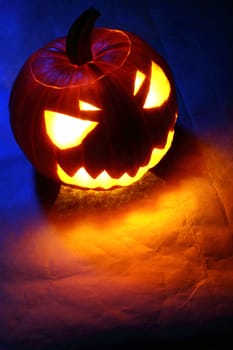 Angry halloween pumpkin in blue light