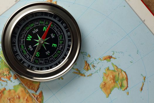 Compass on Earth map background