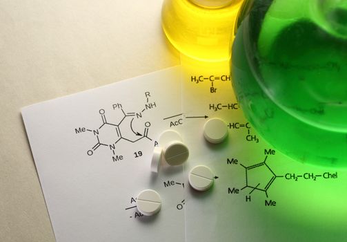 Chemistry reaction formula with white pills