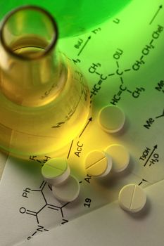 Chemistry reaction formula with white pills