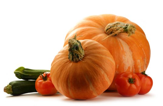 Pumpkins, marrows and tomatoes on white background