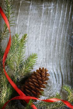 Background with fir and cone on wood
