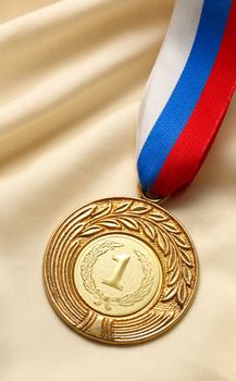 Metal medal on silk wrinkled cloth