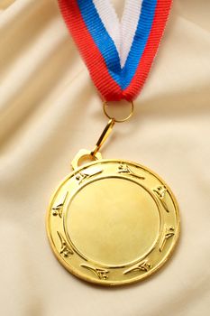 Metal medal on silk wrinkled cloth