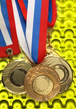Metal medals on abstract bubble background