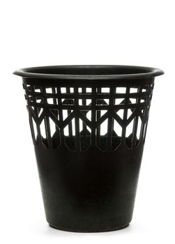 Empty black wastebasket on white