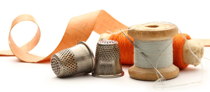 Sewing thimbles, bobbins and needle