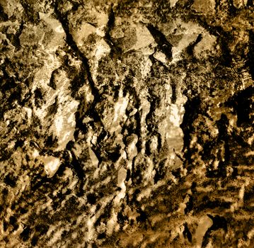 Rough cracked concrete wall as background