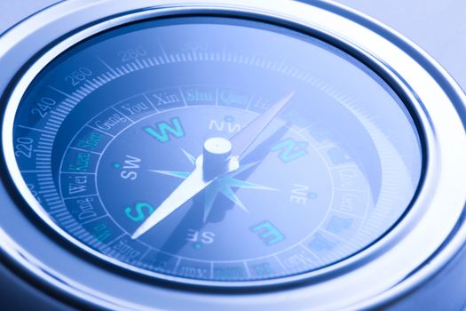 Compass closeup in blue toning