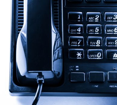 Telephone receiver in blue toning