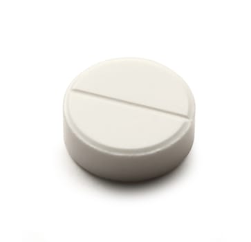 Aspirin pill on white background