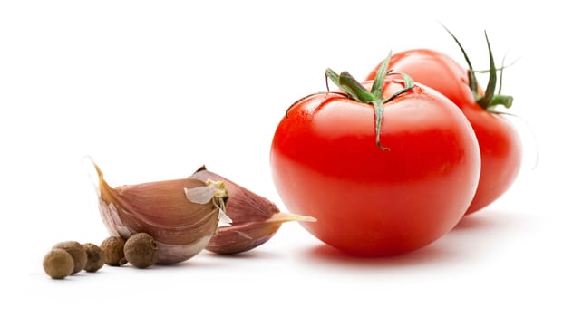 Tomatoes, onion and pepper on white background