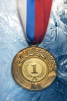 Metal medal on frozen background