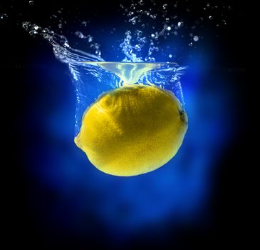 Yellow lemon in water splash