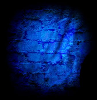 Blue brick stone wall with damaged sheetrock