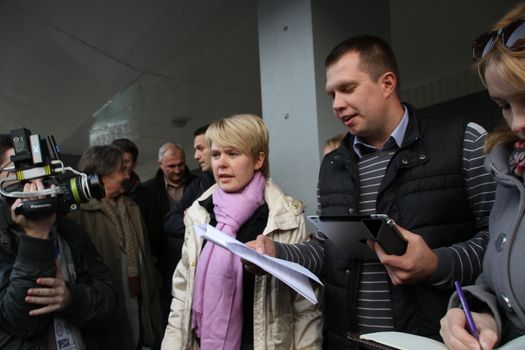 Khimki, Moscow region, Russia - October 14, 2012. Candidate for mayor of Khimki opposition leader Yevgenia Chirikova and her head staff Nikolai Laskin communicate with the press outside the polling station. On election day in the suburban town of Khimki broke sharp competition between the candidate of the Kremlin Oleg Shahov and representative opposition Yevgenia Chirikova.