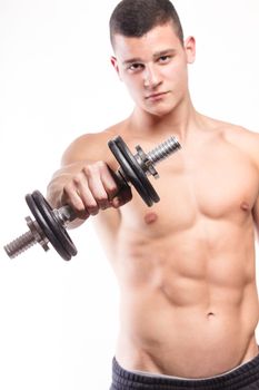 Muscular fitness man holding dumbbell - studio shoot 