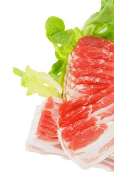 Frame of Sliced Raw Pork Bacon with Lettuce isolated on white background