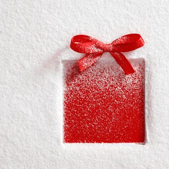 gift with a bow on snow background
