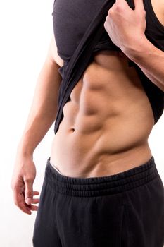 Muscular fitness man torso with six-pack - studio shoot