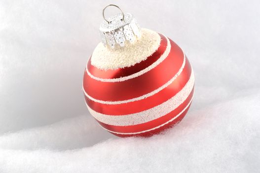 Christmas Bauble on snow white background