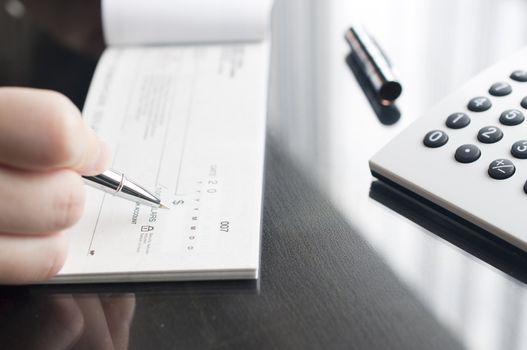 Business woman prepare writing a check 