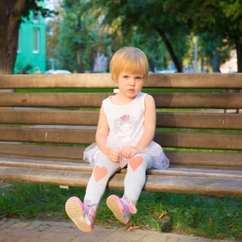 Outdoor portrait  of cute little girl in summer day