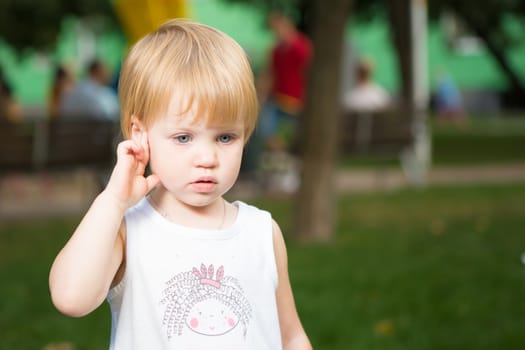 Outdoor portrait  of cute little girl in summer day