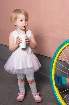 Healthy kid, milk - Portrait of lovely girl drinking fresh milk outdoors