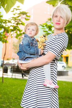 Young mother and her toddler girl have fun