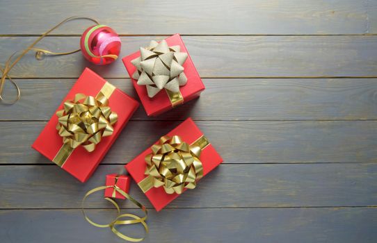 Christmas gifts and decorations over a wooden background