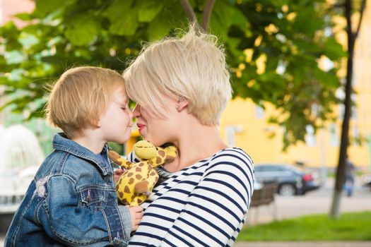 Young mother and her toddler girl have fun