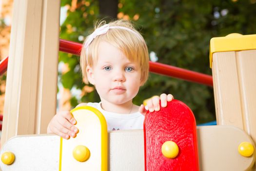 Outdoor portrait  of cute little girl in summer day