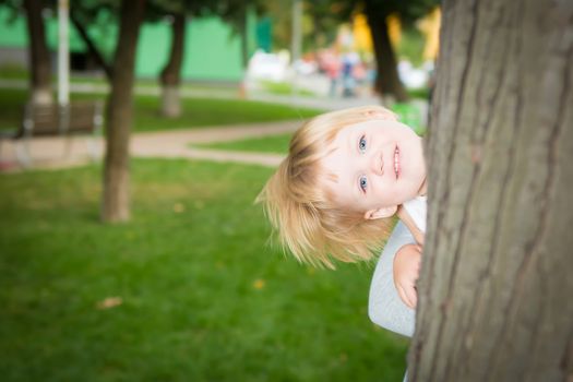 Outdoor portrait  of cute little girl in summer day