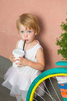 Healthy kid, milk - Portrait of lovely girl drinking fresh milk outdoors