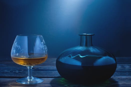 Cognac glass with bottle on the side 