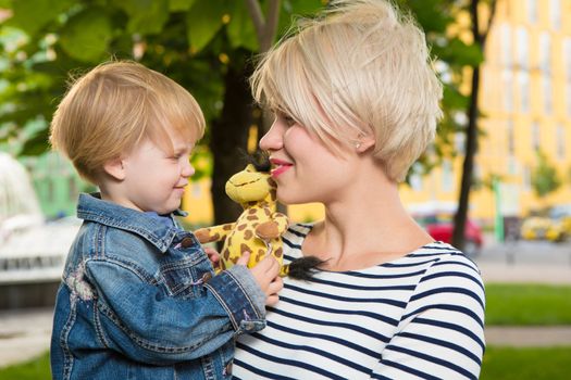 Young mother and her toddler girl have fun