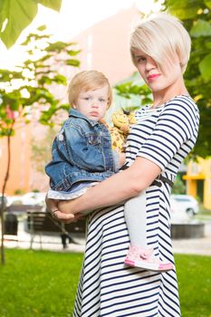 Young mother and her toddler girl have fun