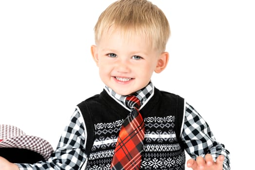 Smiling happy boy with tie shot in the studio on a white background