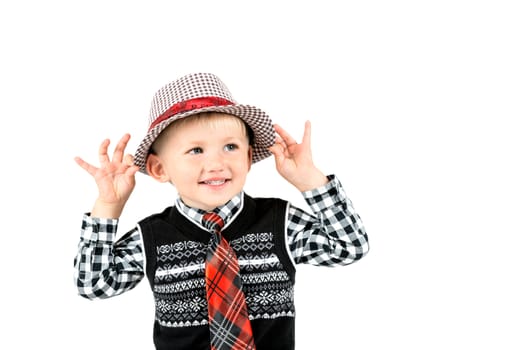 Smiling happy boy in hat and tie shot in the studio on a white background