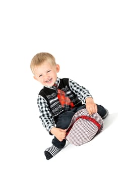 Laughing  happy boy with tie shot in the studio on a white background
